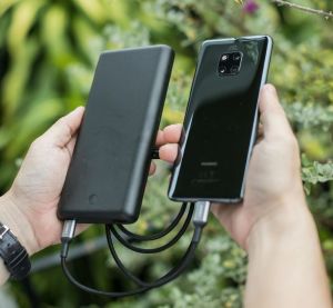A power bank charging a mobile phone.